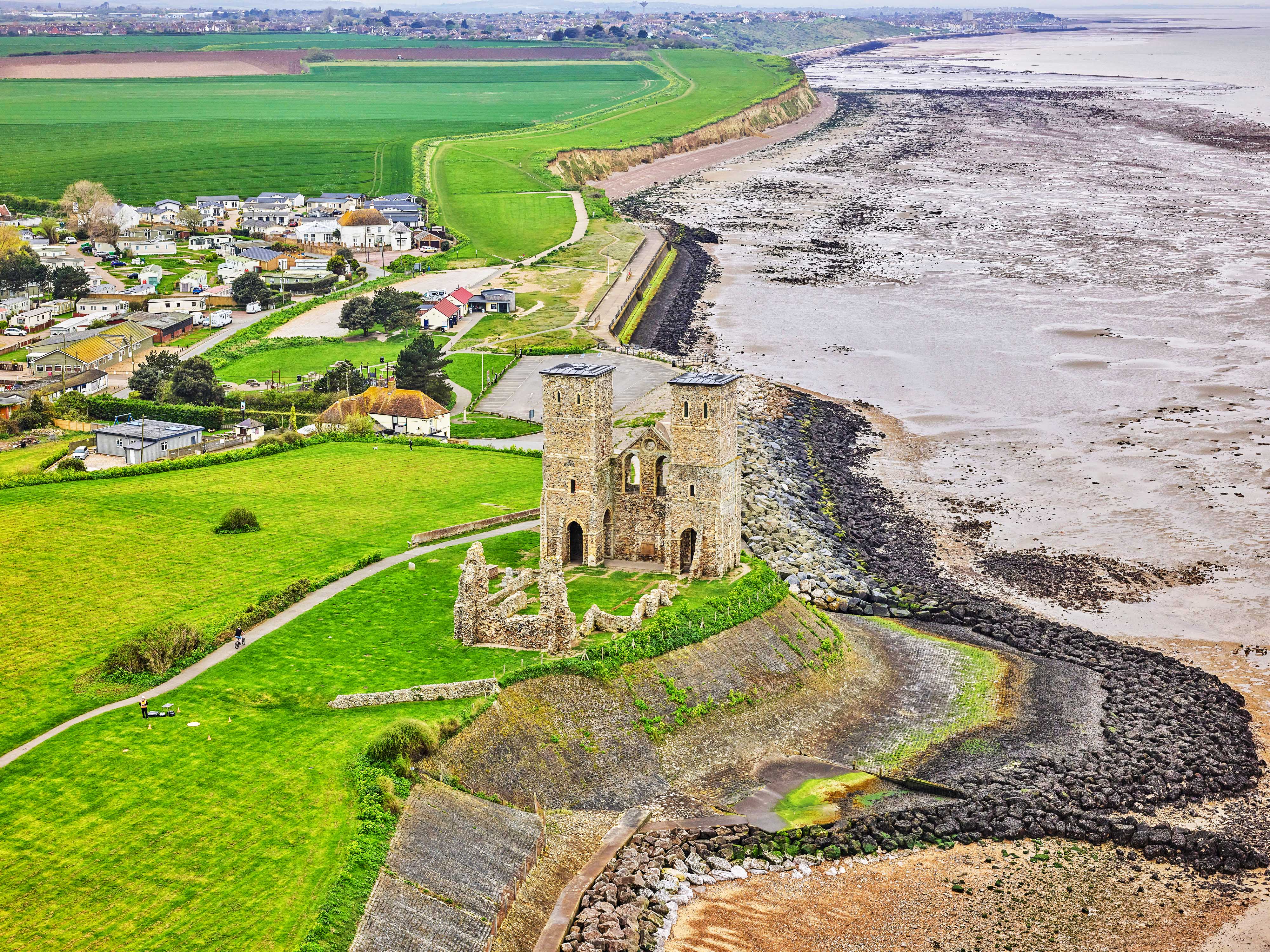 Aerial photo of Reculver Towers and Roman Fort next to the coast