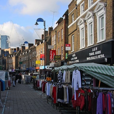 Photo of clothes stalls in Petticoat Lane Market in east London